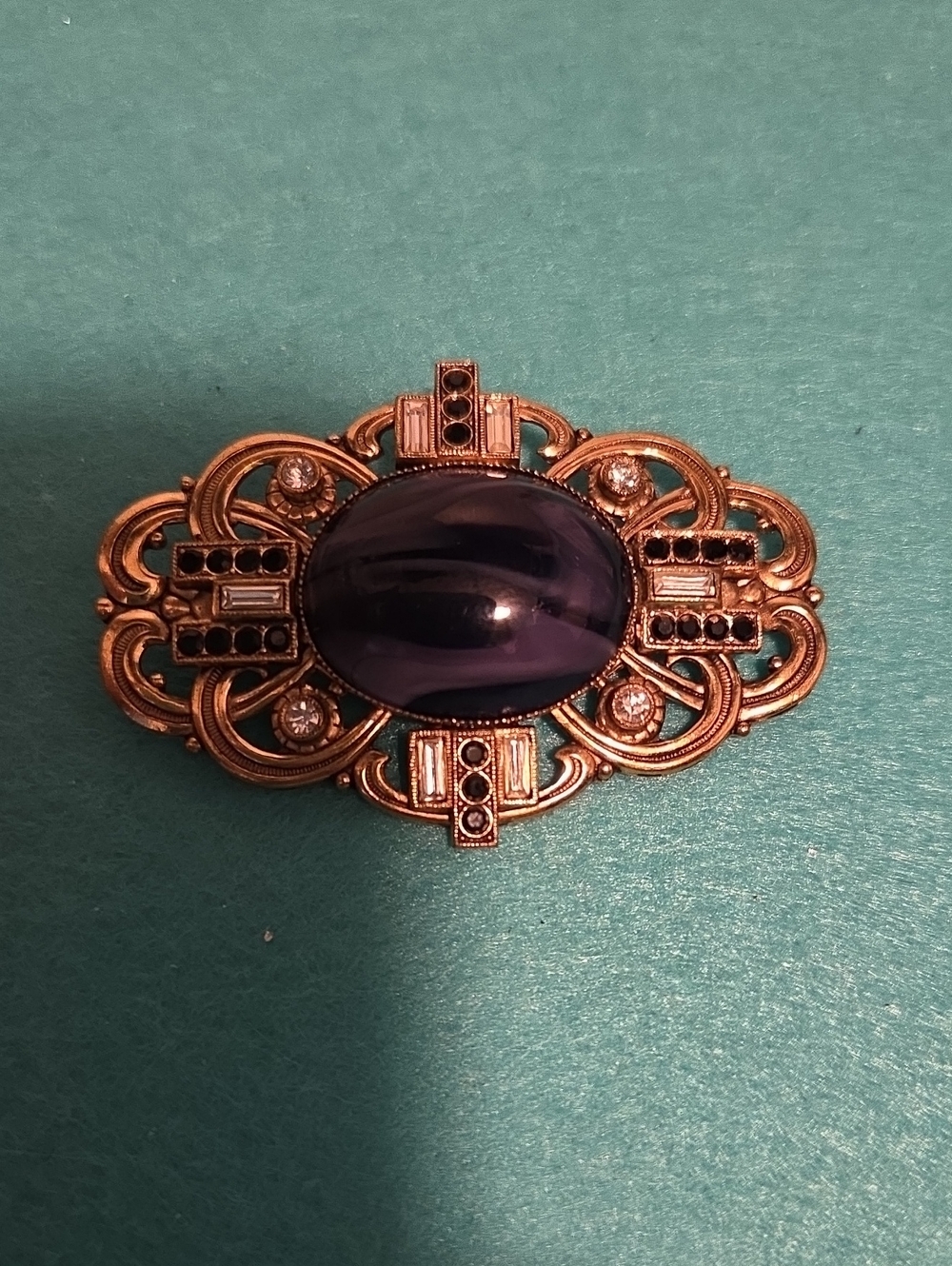 Gold-Tone German Brooch with Purple Art Glass Cabochon
